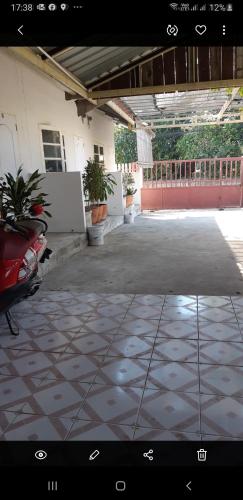 an empty courtyard with plants in a building at Pakchong hostel & wildlife tour in Pak Chong
