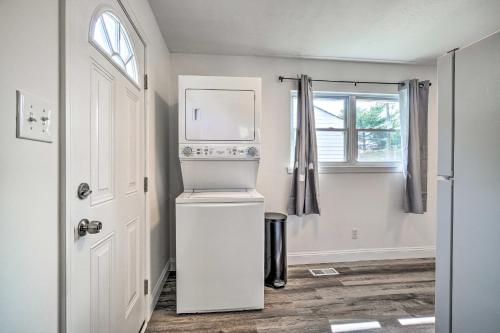 a white refrigerator in a room with a window at Pet-Friendly Pad about 3 Mi to Dtwn Knoxville! in Knoxville