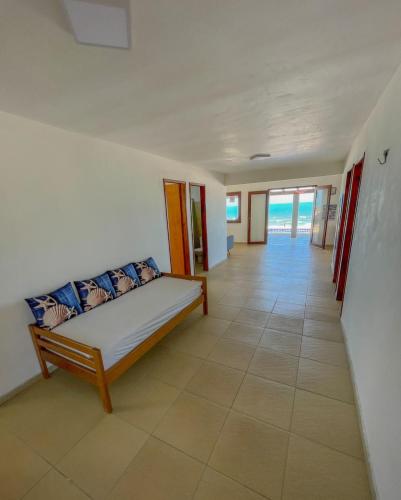 Ένα ή περισσότερα κρεβάτια σε δωμάτιο στο URUAÚ BEACH RESIDENCE