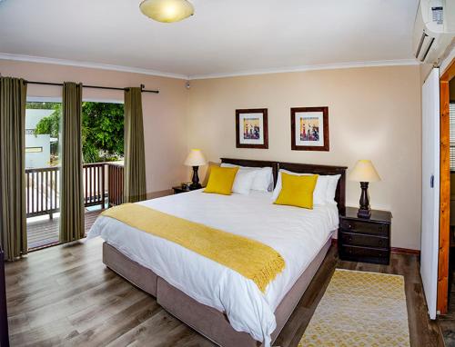 Ένα ή περισσότερα κρεβάτια σε δωμάτιο στο Phumanathi Guesthouse