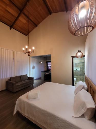 Postel nebo postele na pokoji v ubytování Euetu na Lapinha da Serra