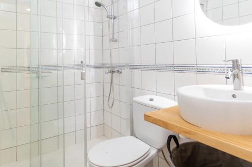 a bathroom with a toilet and a sink at Itan home in Gran Tarajal