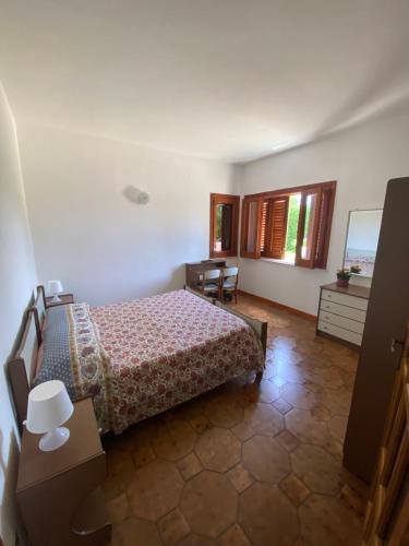 En eller flere senger på et rom på Molucche 22- Appartamenti privati in Villa con piscina