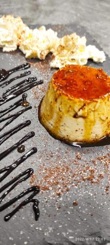 a piece of food on a table with a fork at LA CASONA DE PALMIRA in Caín