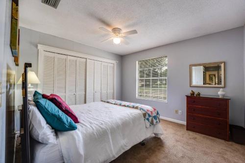a bedroom with a bed and a ceiling fan at Rainey 5577 in Orange Park