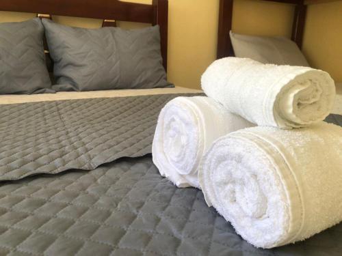 Una cama o camas en una habitación de Pousada Frezza Mergulho