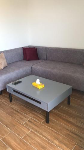 a living room with a couch and a coffee table at Diar Mira in Kelibia