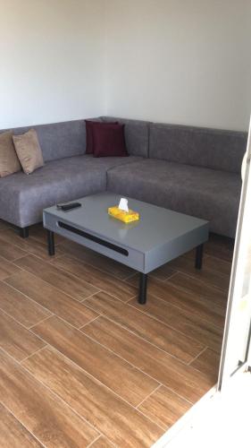 a living room with a couch and a coffee table at Diar Mira in Kelibia