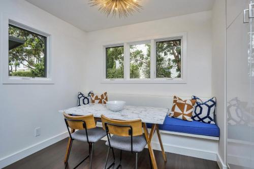 a dining room with a table and chairs and a couch at Heavenly Hideaway A Wine Country Escape in Healdsburg