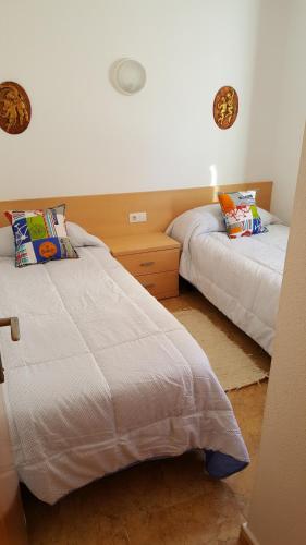 Una cama o camas en una habitación de Apartamento frente al mar en Alcossebre
