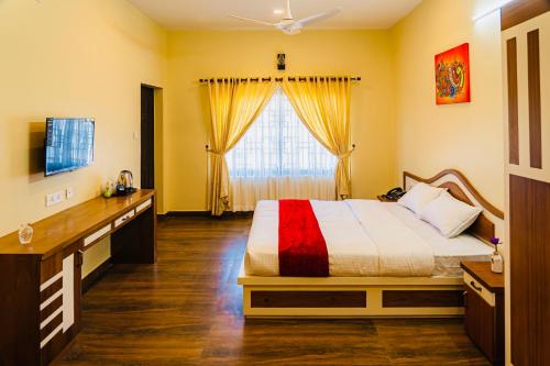 a bedroom with a bed and a large window at Vagamon Vagashore in Vagamon