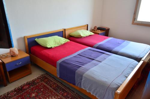 two beds sitting next to each other in a bedroom at Ranch Tanit Djerba in Midoun
