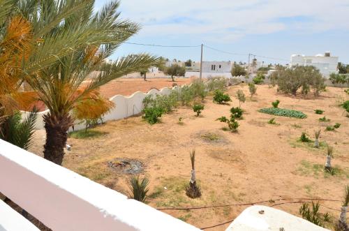 a view of a garden from the balcony of a house at Ranch Tanit Djerba in Midoun