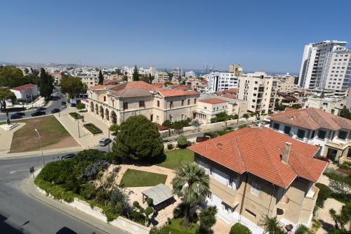 an aerial view of a city with houses and a street at Rise Urban Art Hotel in Larnaka