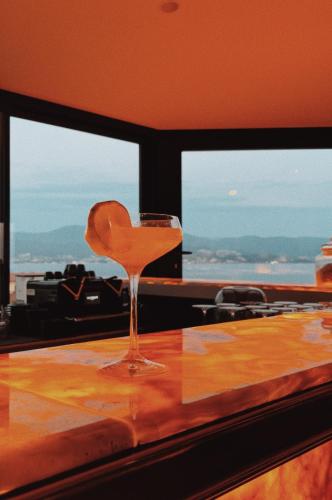 a wine glass sitting on top of a table at Hotel San Carlu Citadelle Ajaccio in Ajaccio