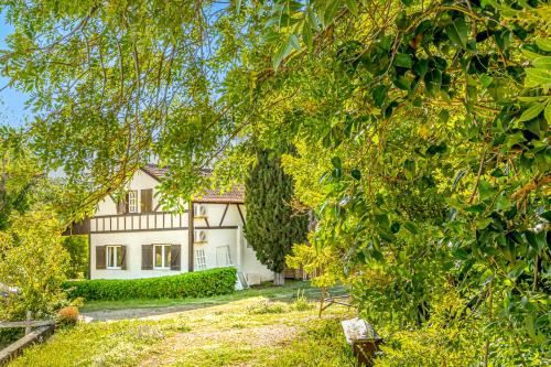 a white house with trees in front of it at Quinta do Boição in Lisbon