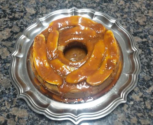 a chocolate glazed donut in a silver tray at Casarão Primavera in Serra Negra