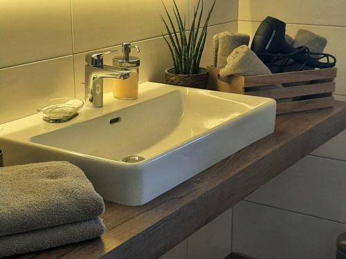 a white sink on a counter in a bathroom at Appartement Eben im Pongau in Eben im Pongau