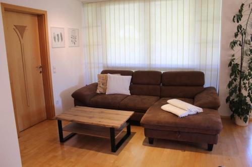 a living room with a couch and a coffee table at Appartement Eben im Pongau in Eben im Pongau