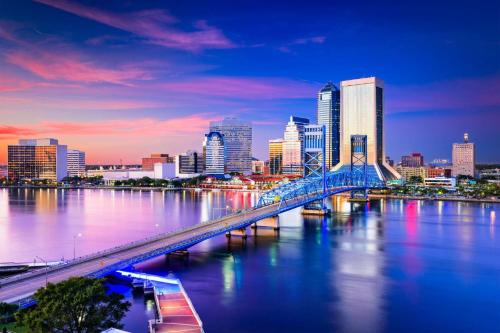 a city skyline with a bridge over a river at Rainey 5577 in Orange Park