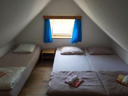A bed or beds in a room at Prázdninový domek v Českém ráji