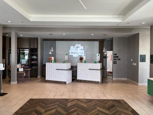 a lobby of a store with two counters in a room at Holiday Inn Greenville - Woodruff Road by IHG in Greenville