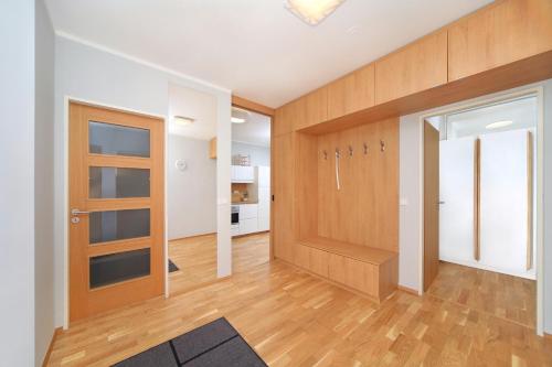 an empty room with a door and a hallway at Apartment Medvědín 331/409 in Špindlerův Mlýn