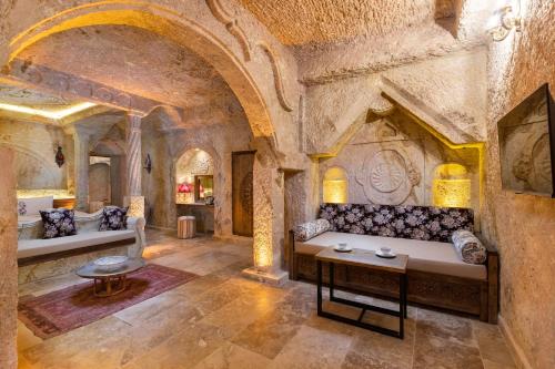 a living room with a couch and a table at Kayata Cave Suites Special Class in Urgup