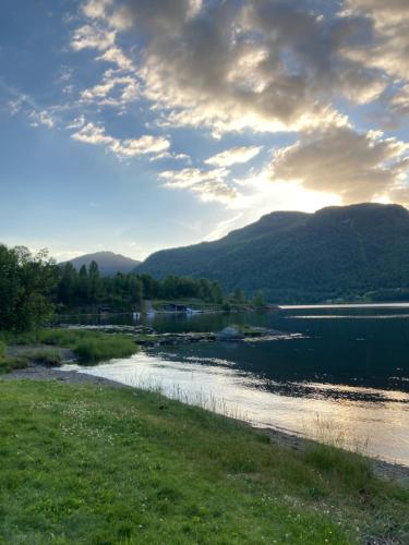 a view of a river with mountains in the background at Havn i Etne with fjordview in Etnesjøen