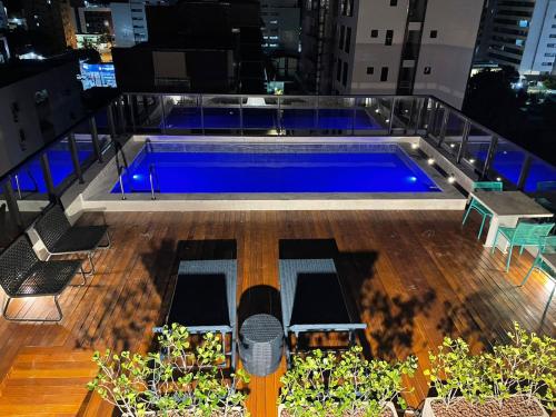 a swimming pool on the roof of a building at Hotel do Mar Tambaú in João Pessoa