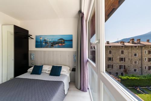 Postel nebo postele na pokoji v ubytování Hotel Canarino