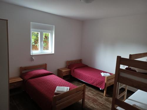 Ένα ή περισσότερα κρεβάτια σε δωμάτιο στο Apartman Milanko