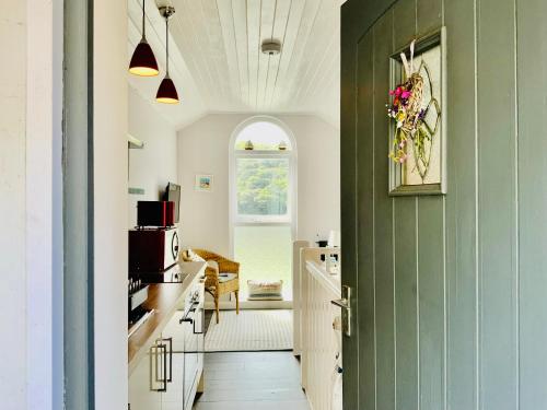 a hallway with a green door in a kitchen at 1 Bed Cottage - Sleeps 2 - Parking - Wifi in Truro
