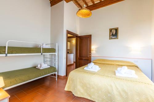 a bedroom with two bunk beds in a room at Antica Villa Castelli in Gubbio