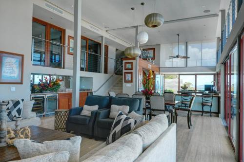 a living room with a couch and a table at Happy Days Villa A in Fajardo