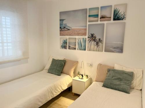 Posteľ alebo postele v izbe v ubytovaní Tarifa Cozy House - Central - Parking - Wifi