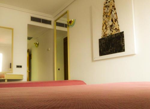 Postel nebo postele na pokoji v ubytování Hotel Azuqueca