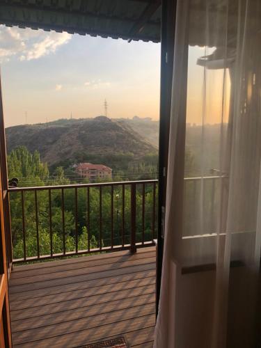a balcony with a view of a mountain at Karen's Dom & Terrace in Yerevan