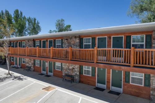 a building with a deck on the side of it at Silver Ridge Lodge in Salida
