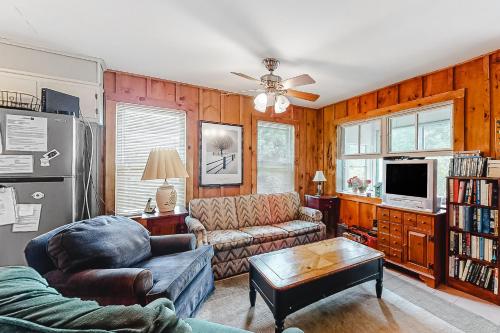 a living room with a couch and a table at Red Grill in Castleton