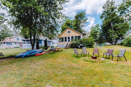 a yard with chairs and a kayak and a house at Red Grill in Castleton