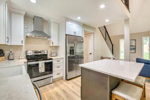 a kitchen with white cabinets and a counter top at Wildwood in Fletcher