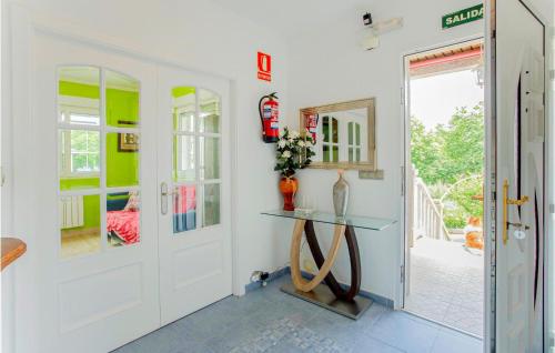 a room with a door and a table in it at 4 Bedroom Awesome Home In Chantada in Chantada