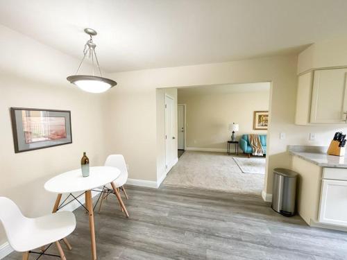 a kitchen and living room with a table and chairs at Sleepover 1BD 1BA Oklahoma City Apartments in Oklahoma City