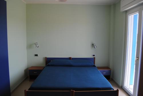 Ліжко або ліжка в номері B&B Alla Corte Blu