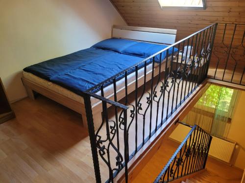 a bedroom with a bunk bed on a staircase at Mohás Vendégház Kőszeg Mohás út 107 in Kőszeg