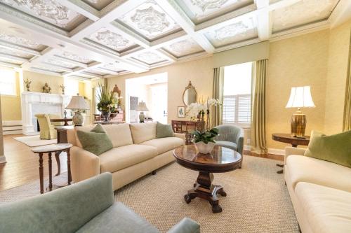 a living room with a couch and a table at The Edenton Collection-The Granville Queen Inn in Edenton