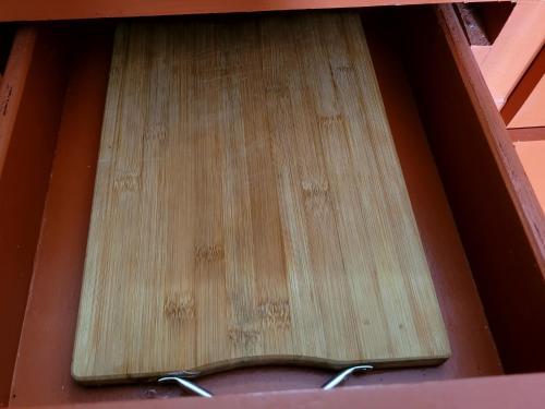 a drawer in a box with a pair of tongs at ANDY'S PLACE in Legazpi