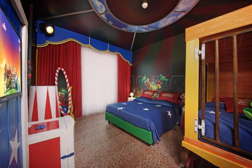a childs bedroom with a mickey mouse bedroom at Gardaland Hotel in Castelnuovo del Garda
