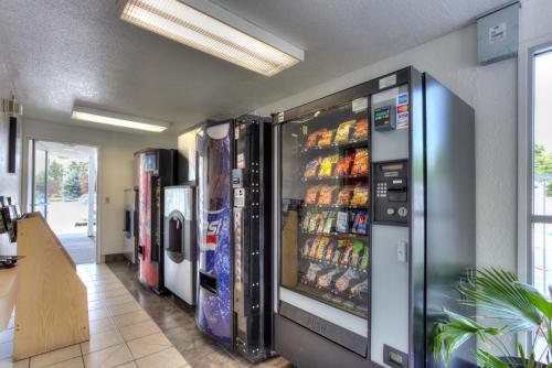 a grocery store with a vending machine filled with drinks at Motel 6-Tigard, OR - Portland South - Lake Oswego in Tigard